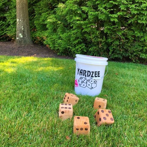 Giant Yahtzee dice and bucket