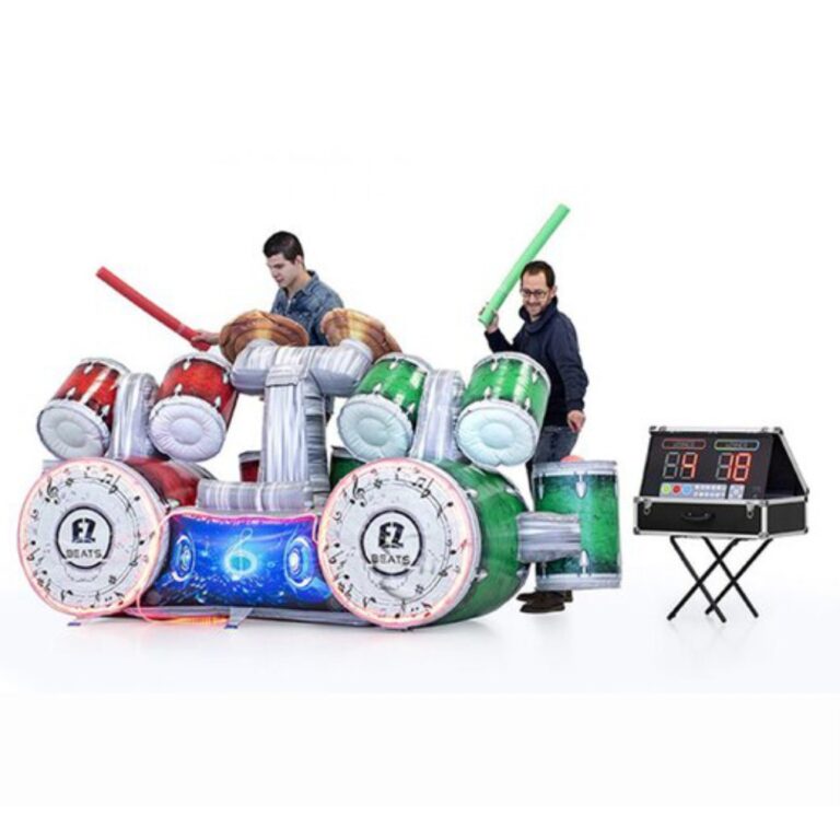 two people playing battle of the drummer inflatable arcade game