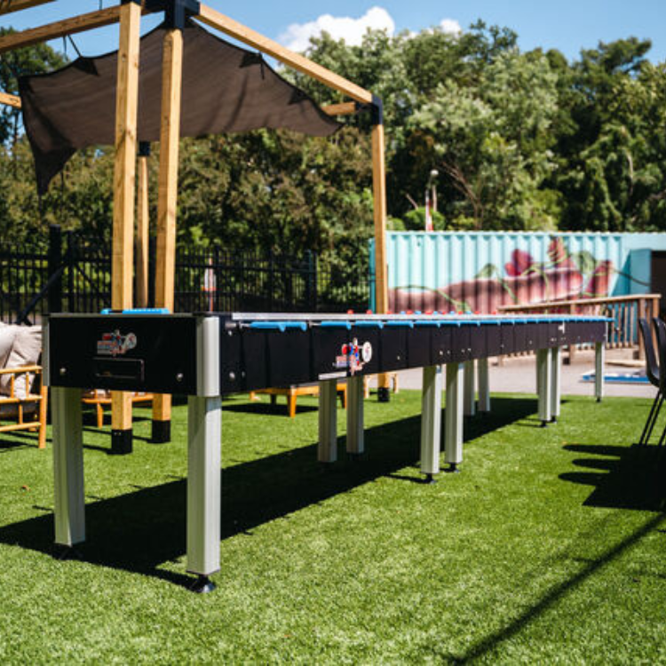 super long foosball table for 24 people