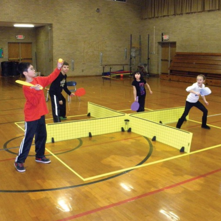 kids playing pickle pong, pickle ball in four quadrants