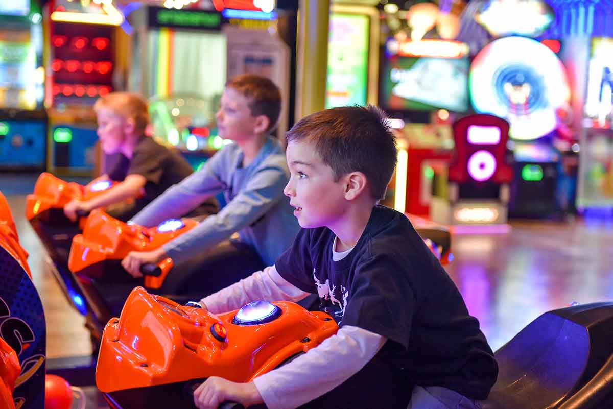 young-boy-and-his-friends-playing-a-motorcycle-game